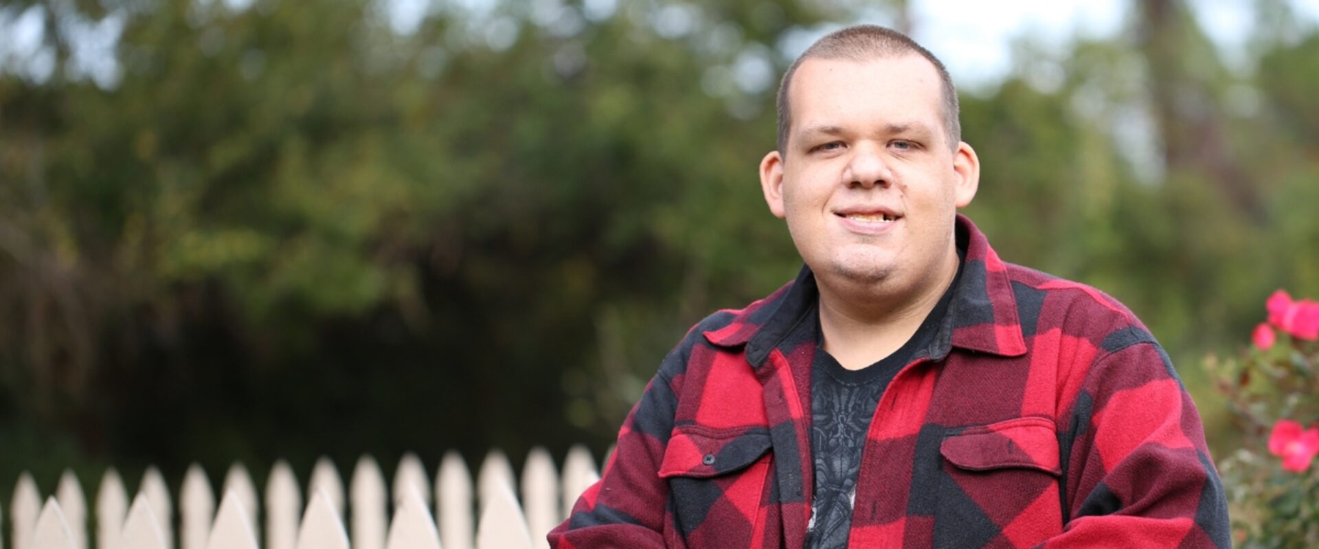 Papist Way Supported Accommodation resident smiling outdoors.