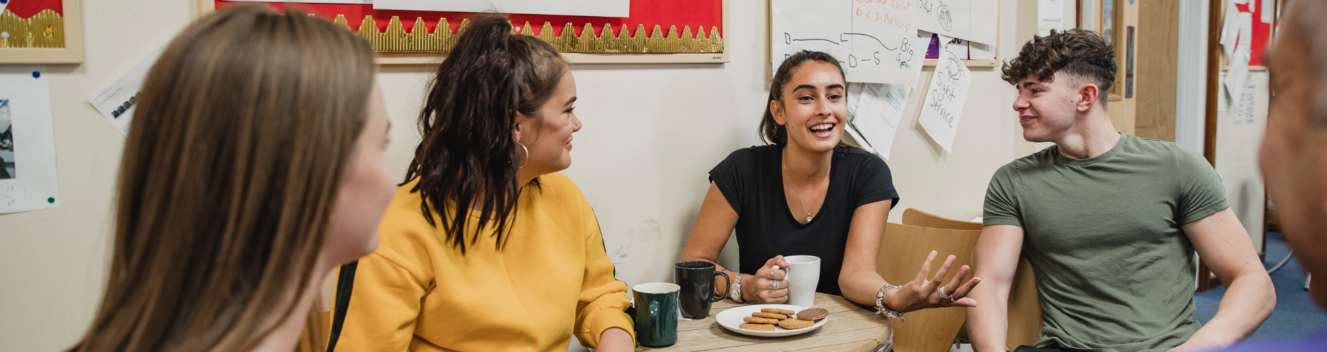 Young people socialising and talking in a community setting.