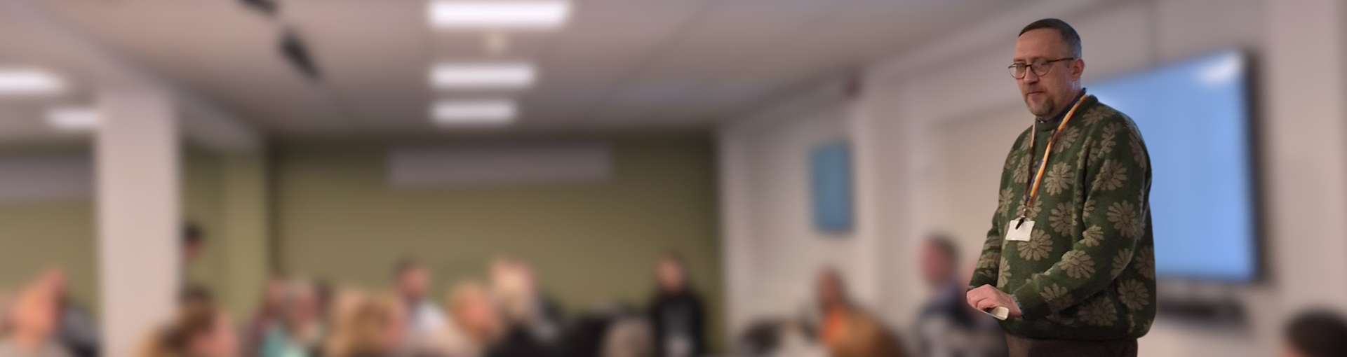 Chris Brown, Lived Experience and Involvement Coordinator at Response, presenting to a room of people.