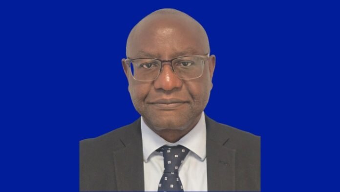 Photo of Response employee, Dapo Olugbodi, wearing a dark suit, smiling at the camera.