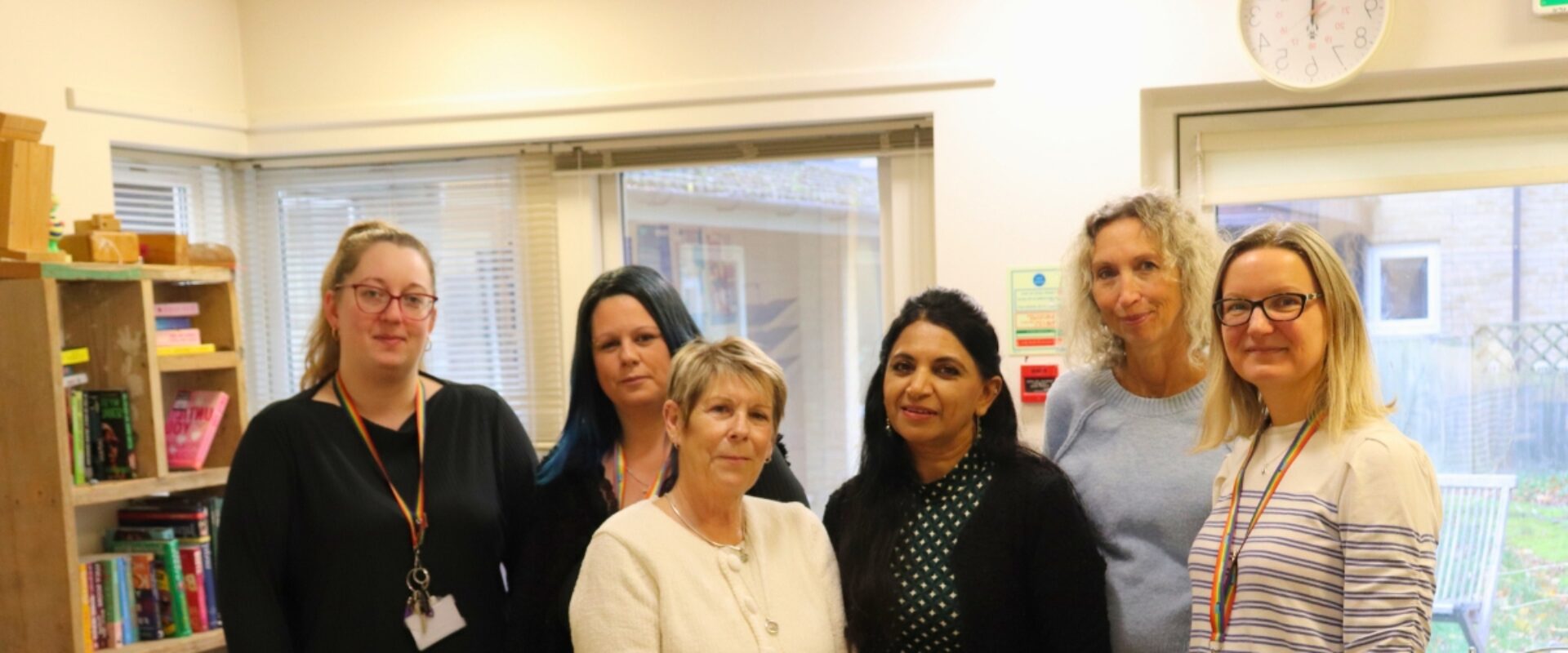 Six Response employees standing together smiling.