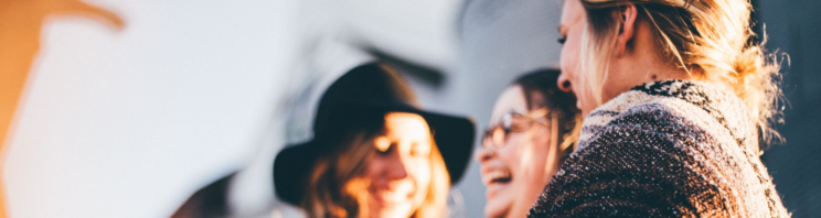 Group of women laughing together.