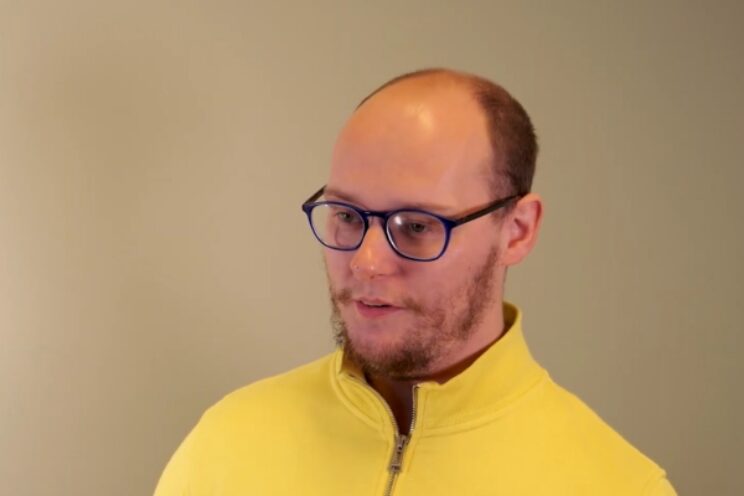 Response resident, Patrick, in yellow top and glasses.